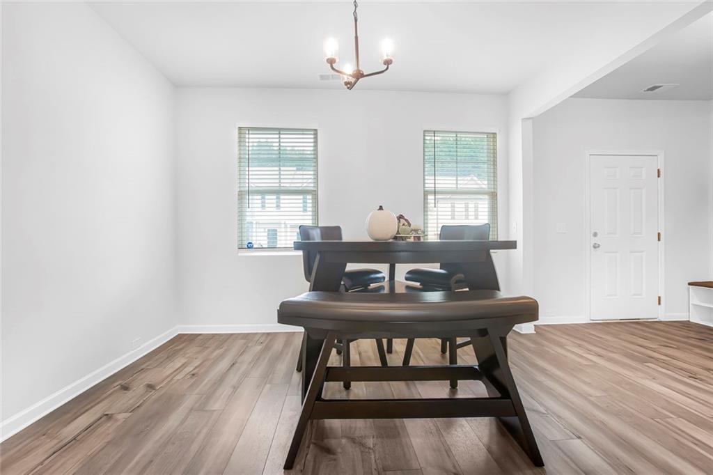3570 Saratoga Circle Decatur, GA 30034 - Photo 5 of 26 a view of a dining room with furniture window and wooden floor