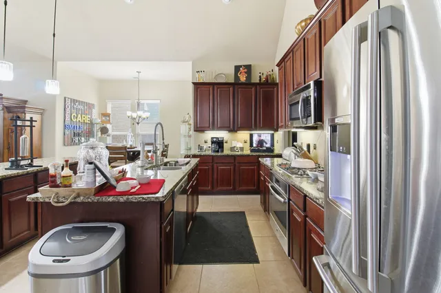 a kitchen that has a sink and a stove