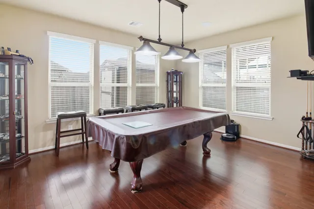 a view of a dining room with furniture window and wooden floor