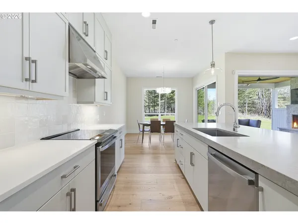 a kitchen with a sink and large window
