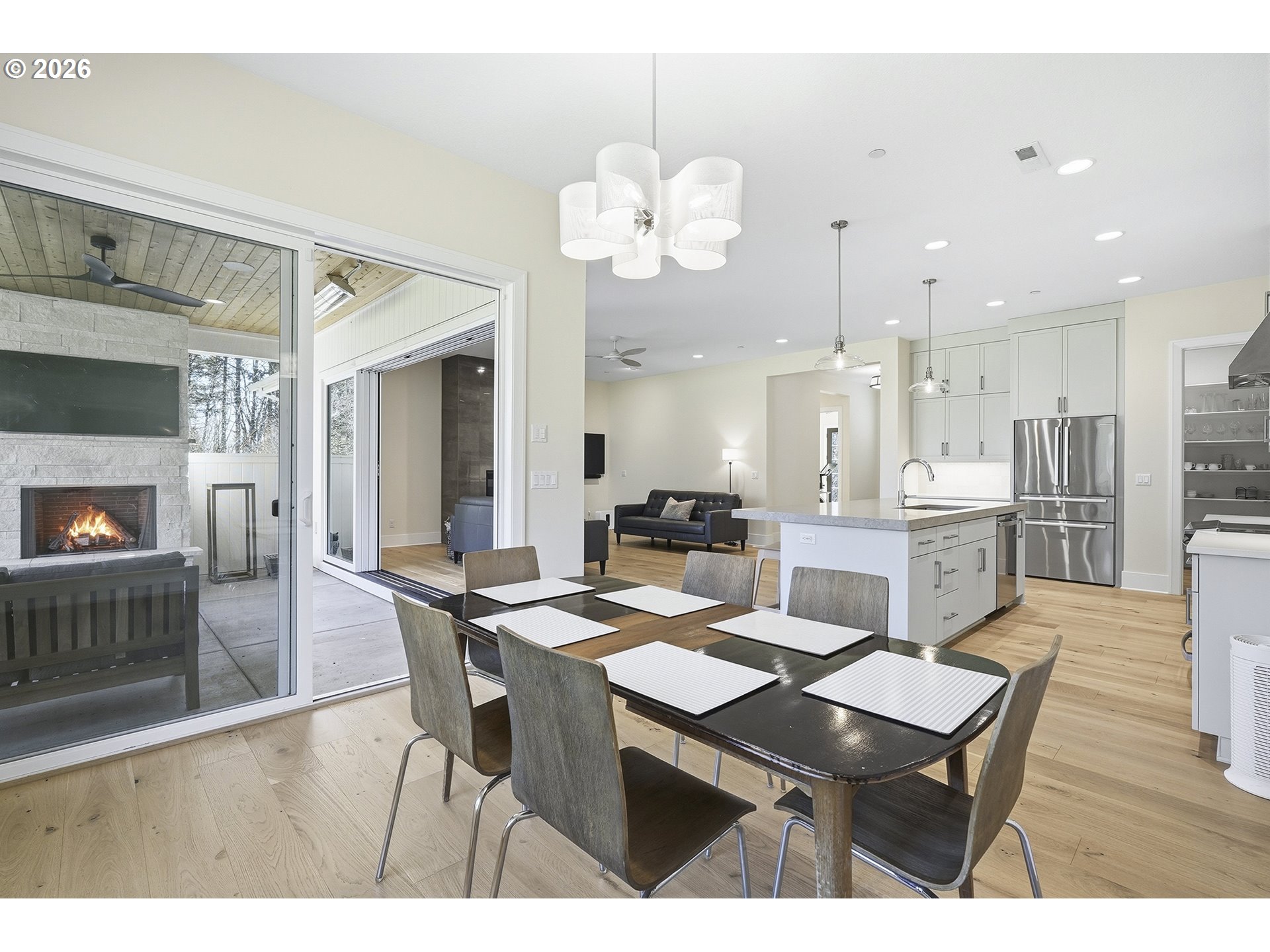 18771 Northwest Collins Road North Plains, OR 97133 - Photo 18 of 48 a view of a dining room with furniture and wooden floor