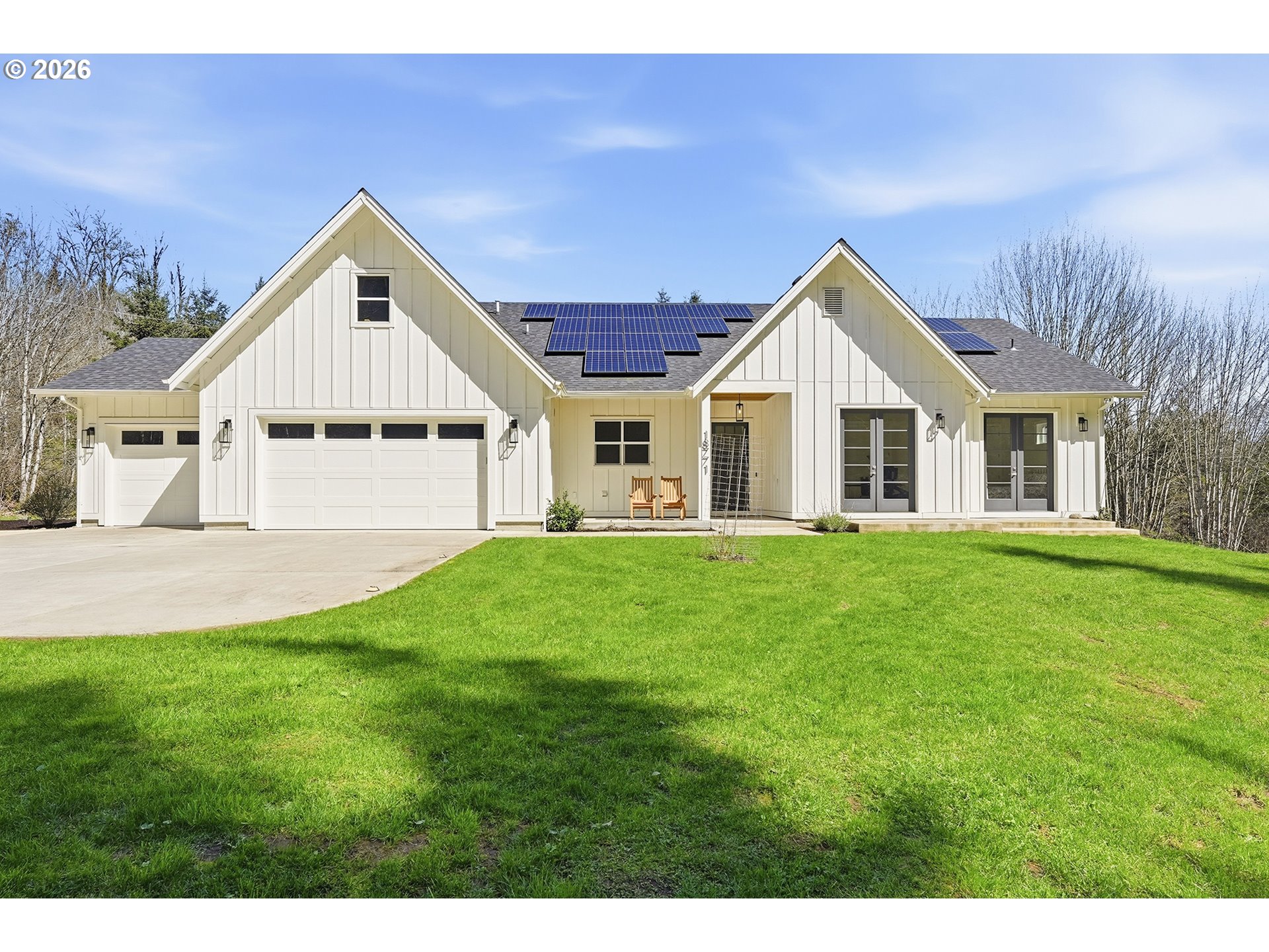 18771 Northwest Collins Road North Plains, OR 97133 - Photo 2 of 48 a view of a house with a big yard potted plants and large tree