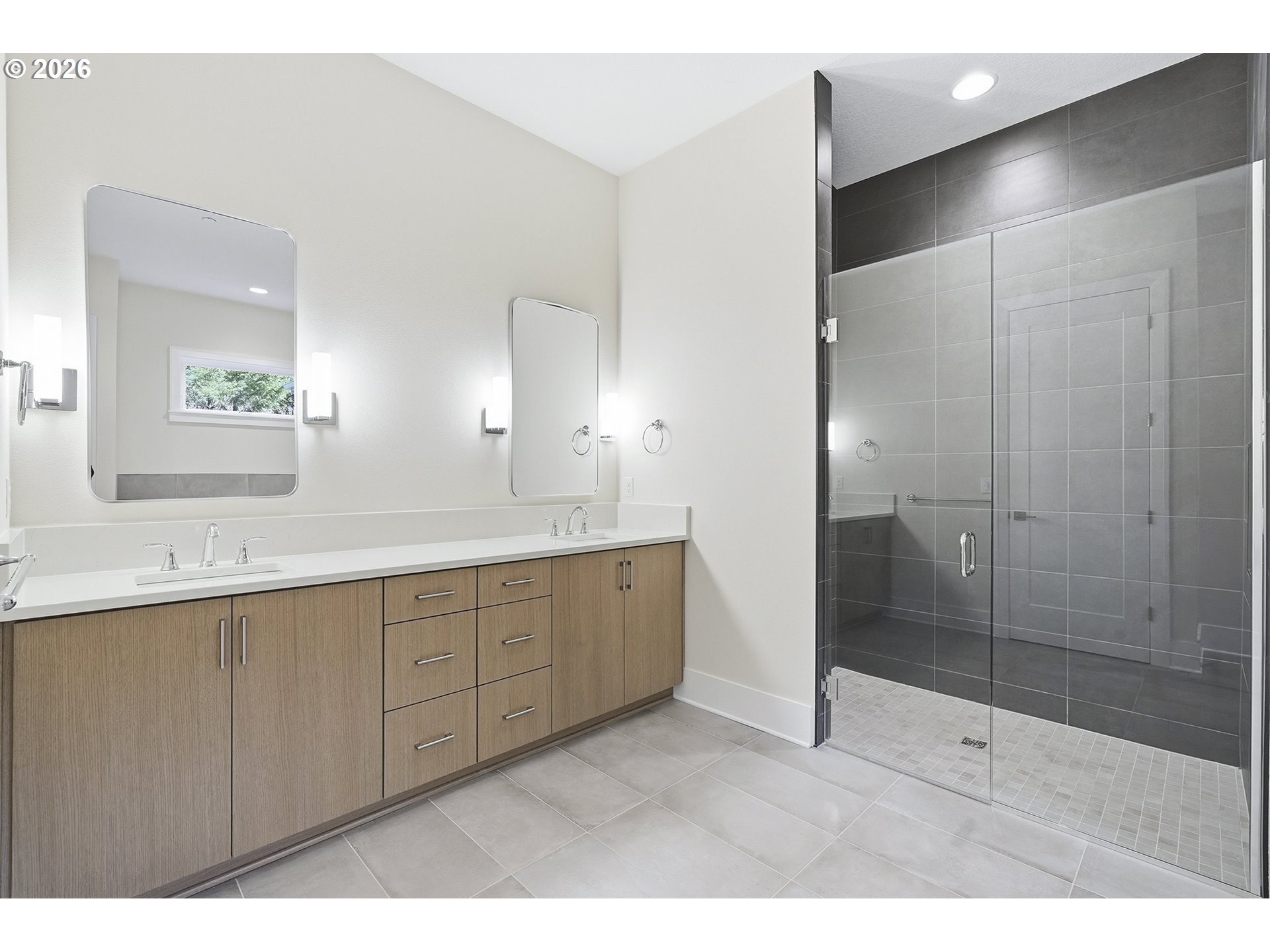 18771 Northwest Collins Road North Plains, OR 97133 - Photo 25 of 48 a bathroom with a shower sink and mirror