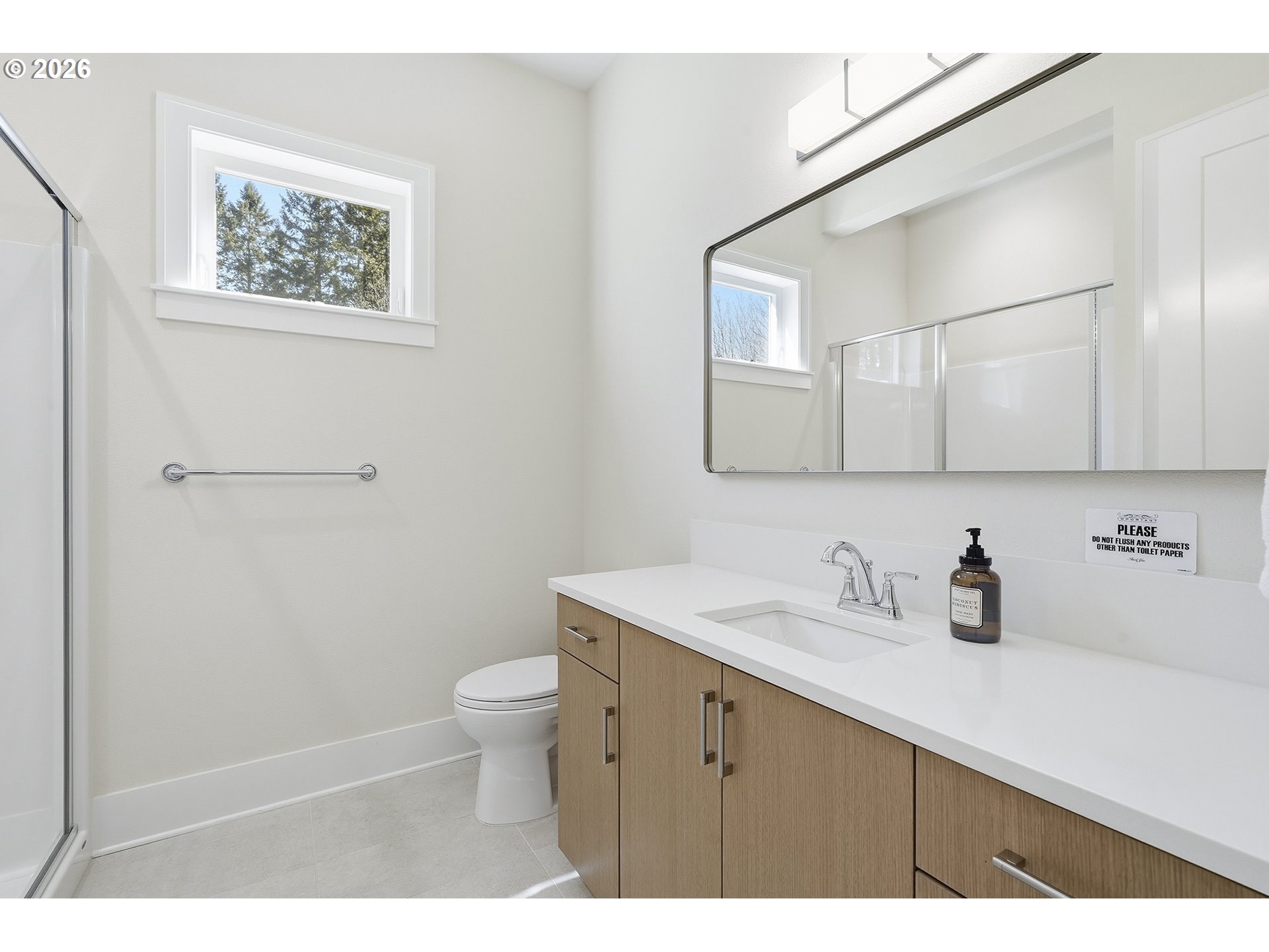 18771 Northwest Collins Road North Plains, OR 97133 - Photo 33 of 48 a bathroom with a sink a toilet and mirror