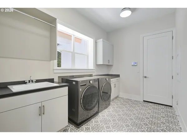 a view of a chairs and a table in the patio