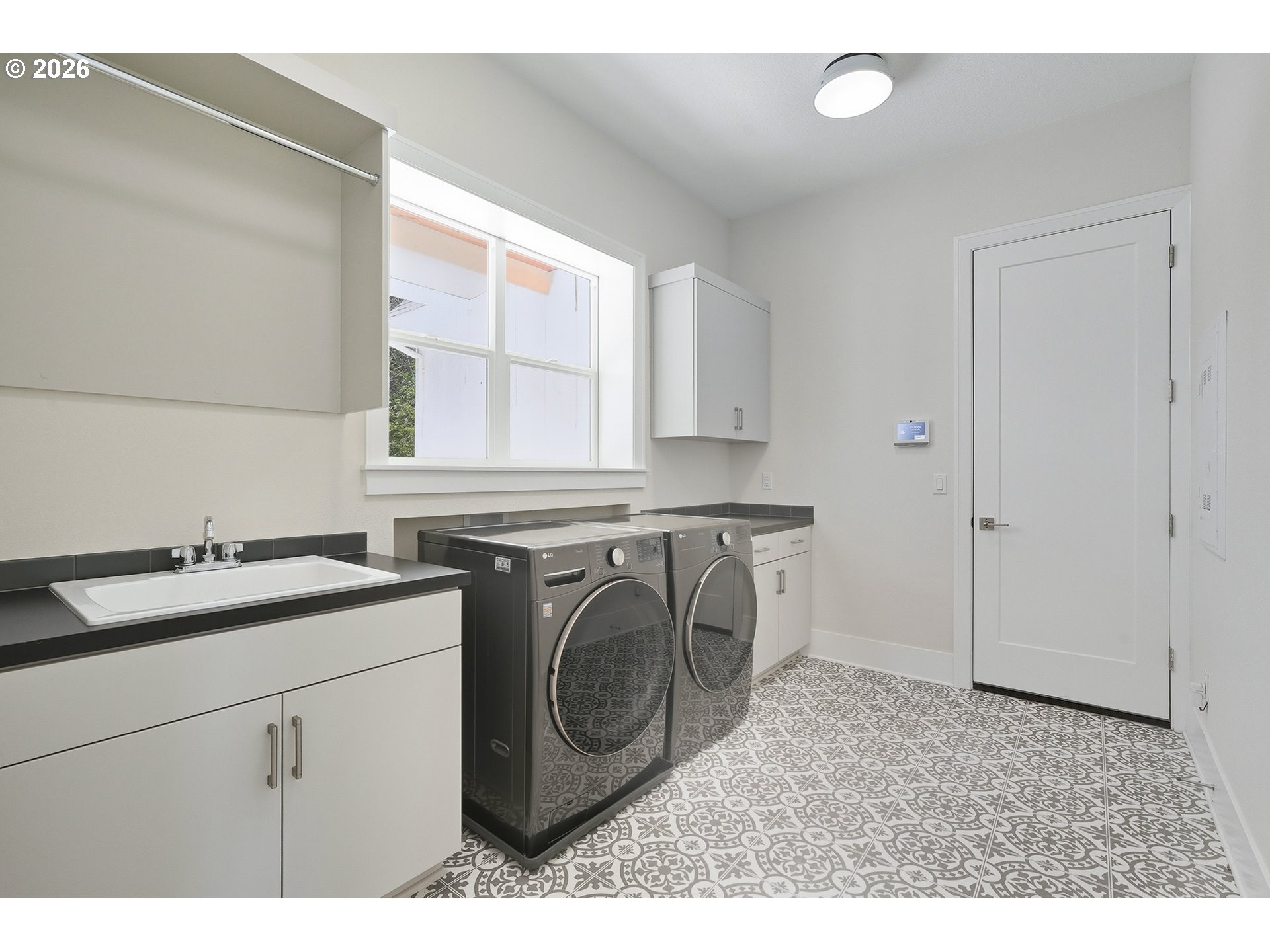 18771 Northwest Collins Road North Plains, OR 97133 - Photo 35 of 48 a utility room with sink dryer and washer