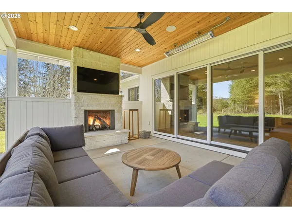 a view of a white house with a sink and yard