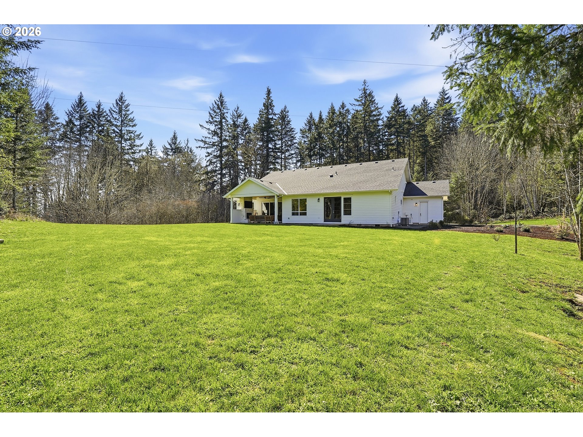 18771 Northwest Collins Road North Plains, OR 97133 - Photo 41 of 48 a view of a house with a yard and a large tree