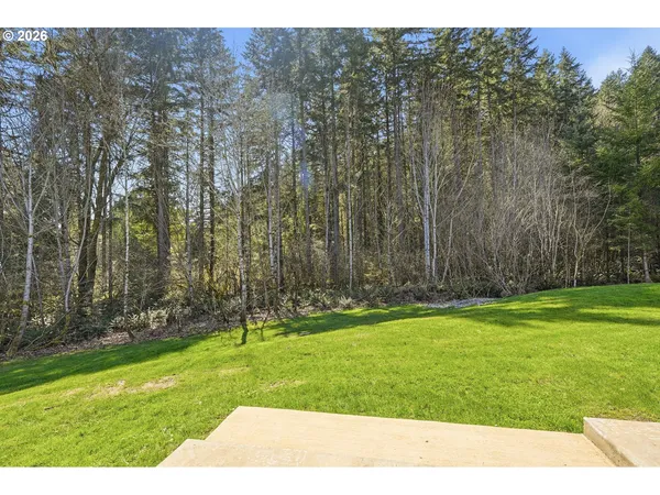 an aerial view of a house with yard basket ball court