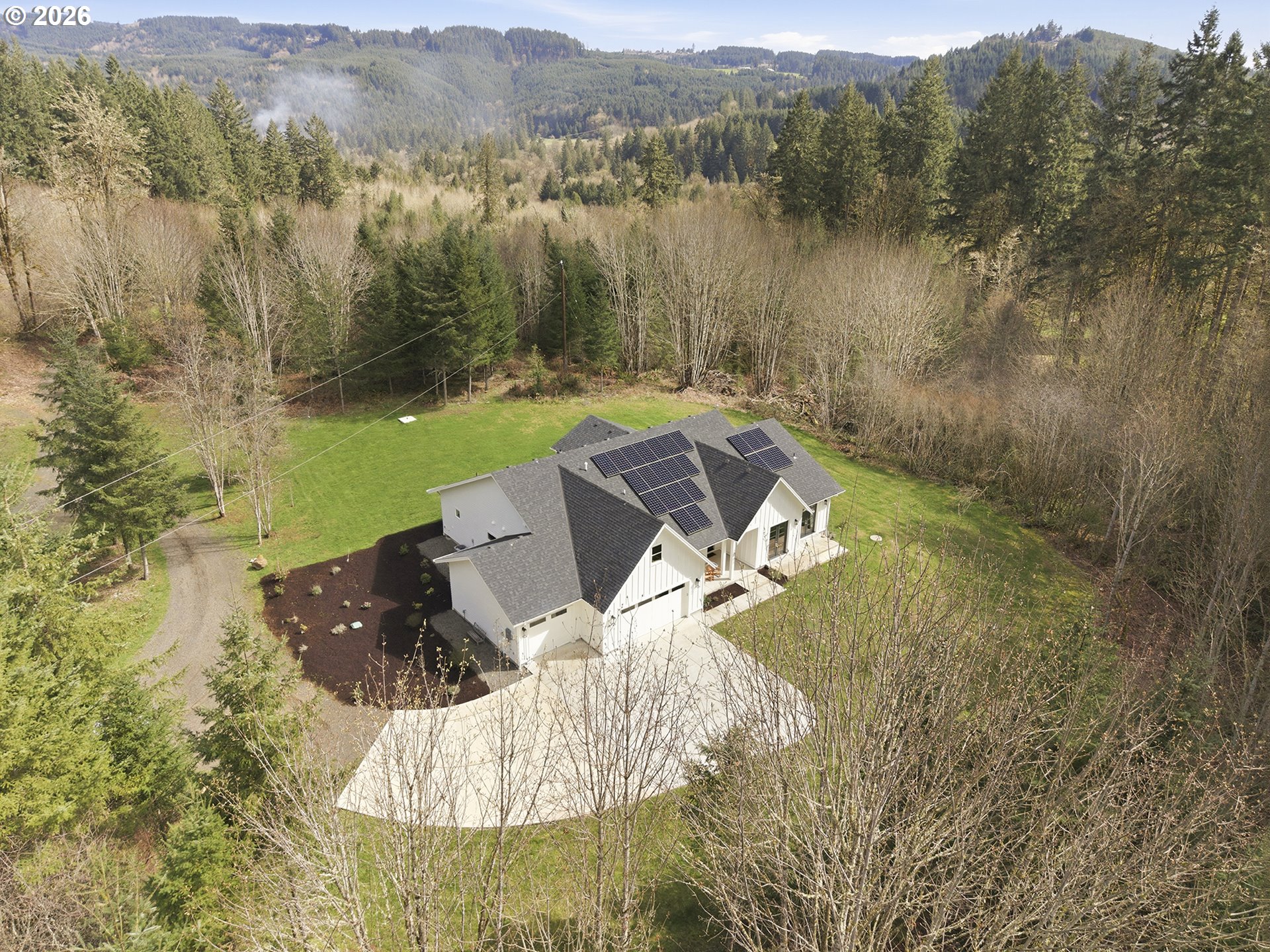 18771 Northwest Collins Road North Plains, OR 97133 - Photo 45 of 48 a view of a lake with a mountain in the background