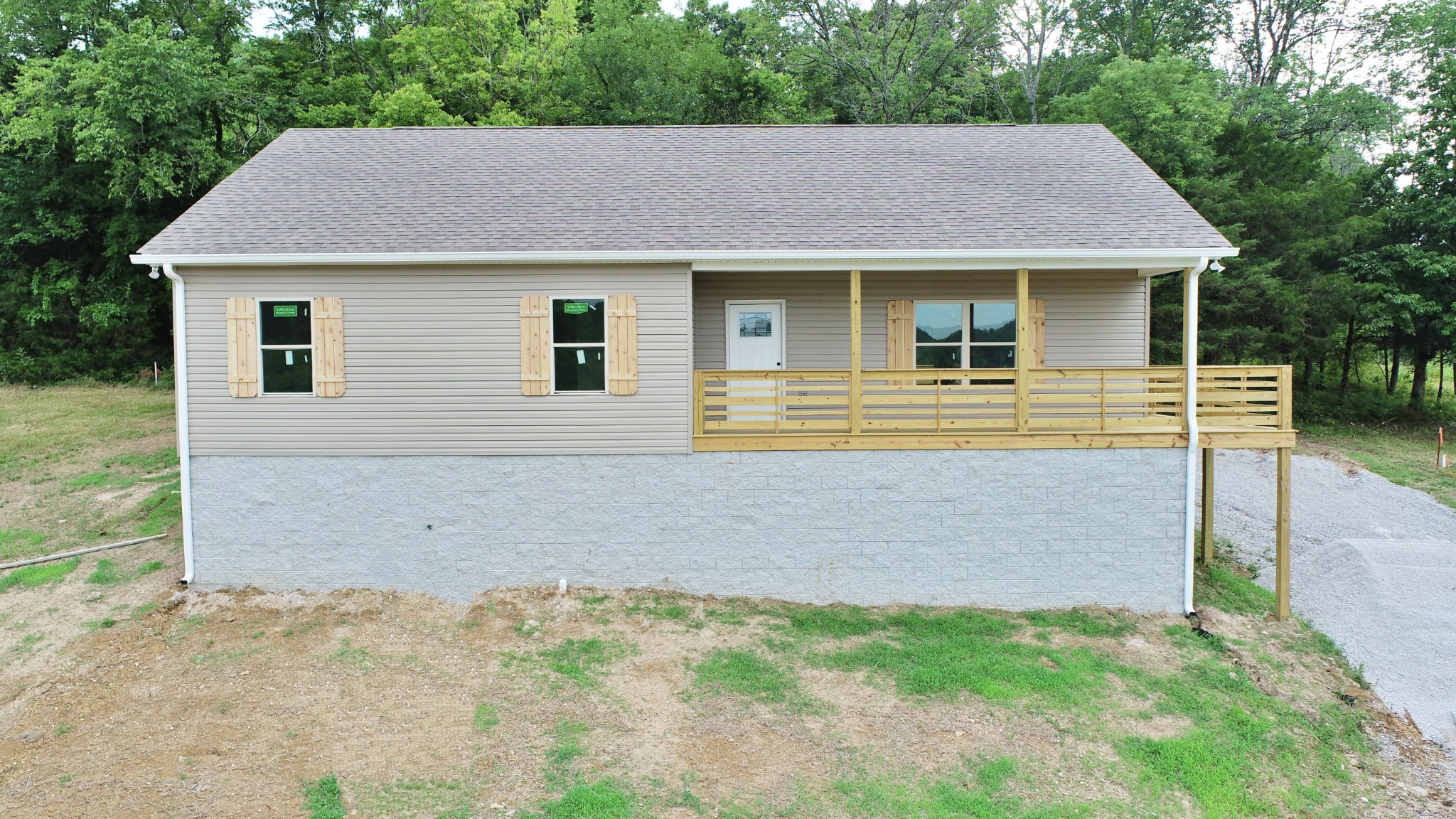 62 Shoulders Road Dixon Springs, TN 37057 - Photo 1 of 22 a front view of a house with garden
