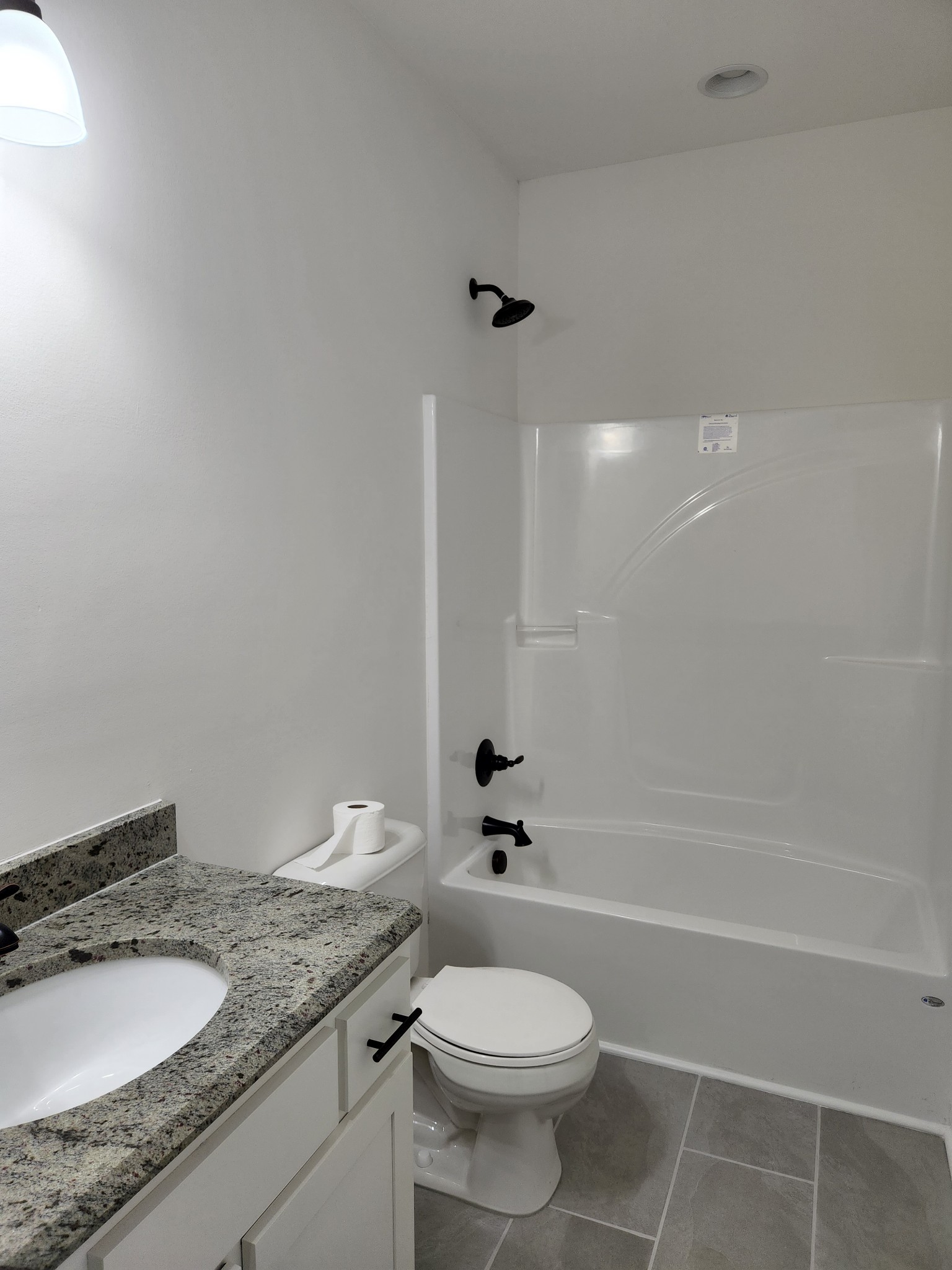 62 Shoulders Road Dixon Springs, TN 37057 - Photo 14 of 22 a bathroom with a granite countertop sink a toilet and shower