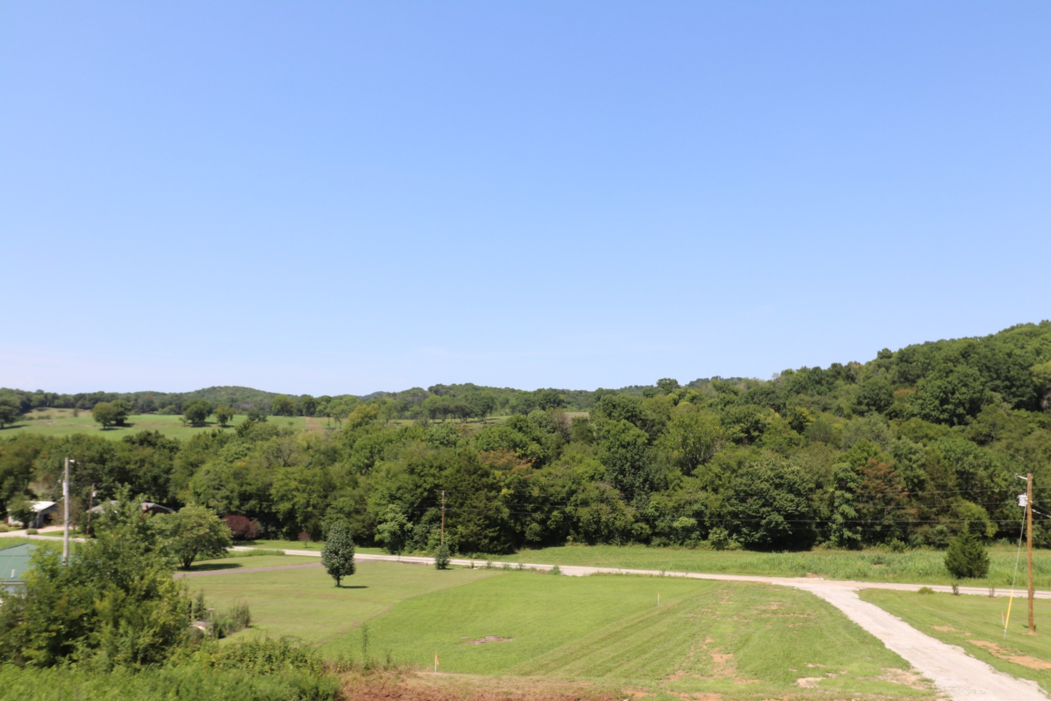 62 Shoulders Road Dixon Springs, TN 37057 - Photo 16 of 22 a view of a field with a tree in the background