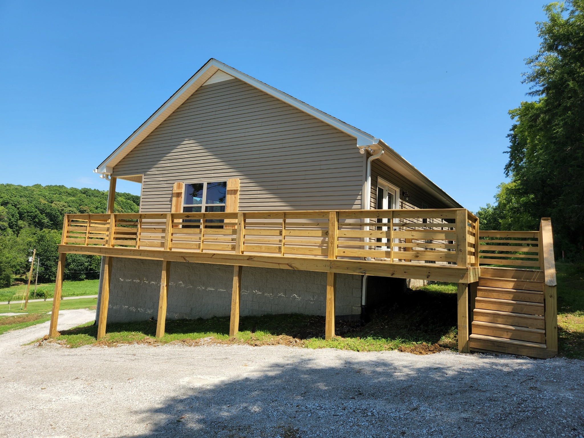 62 Shoulders Road Dixon Springs, TN 37057 - Photo 21 of 22 a front view of a house with a yard and garage