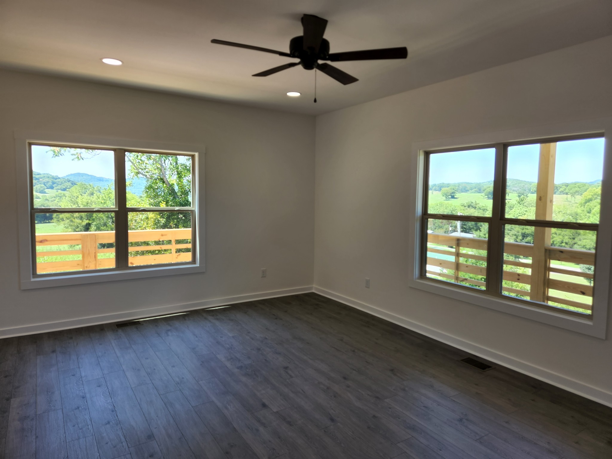 62 Shoulders Road Dixon Springs, TN 37057 - Photo 4 of 22 a view of an empty room with wooden floor and a window