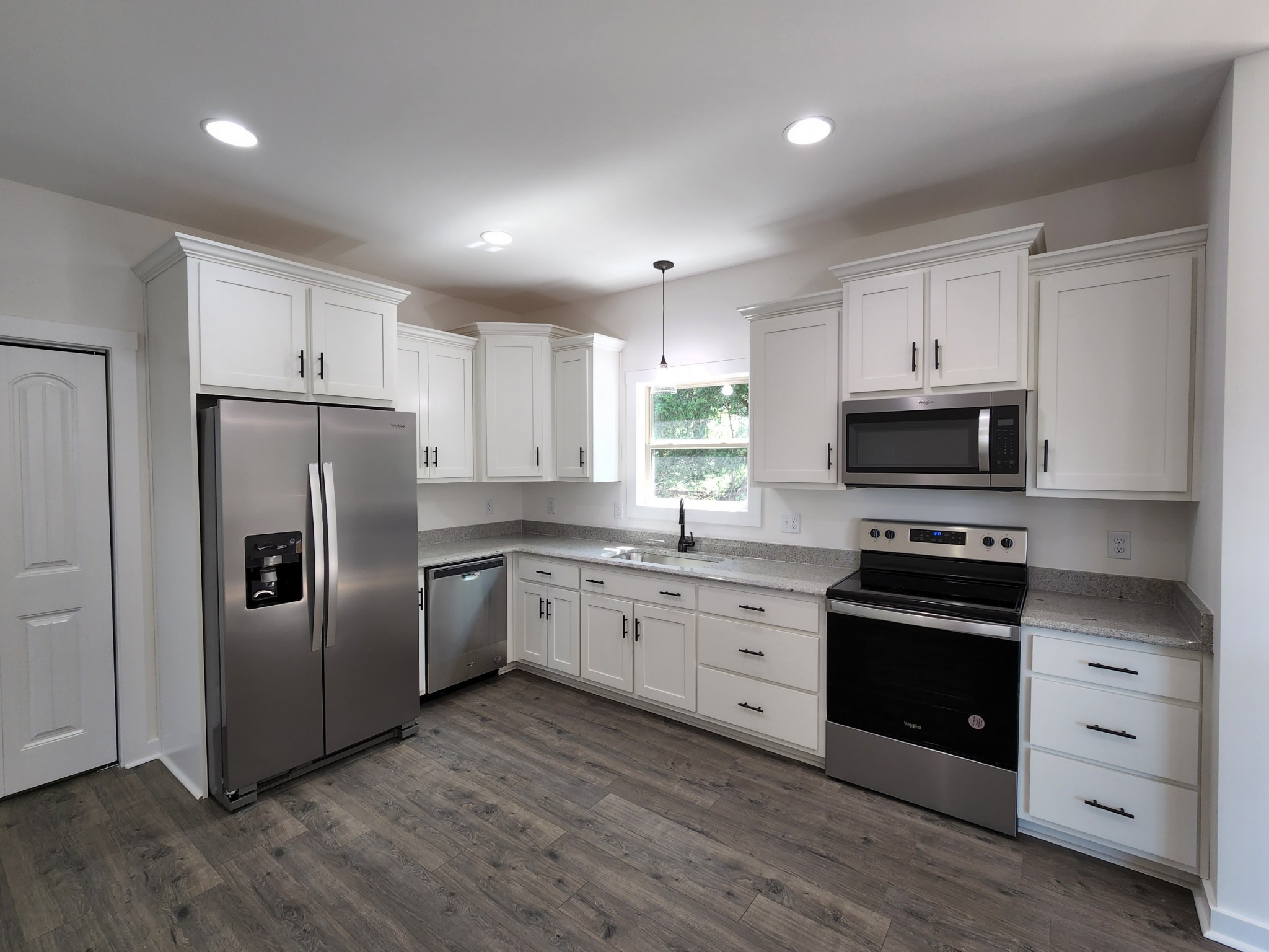 62 Shoulders Road Dixon Springs, TN 37057 - Photo 6 of 22 a kitchen with granite countertop a refrigerator stove and sink