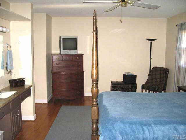 Grand master suite with ceiling fan, separate vanity area, & walk-in closet Other