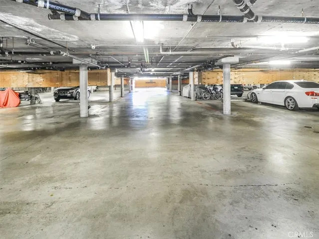 a view of parking garage with a car parked