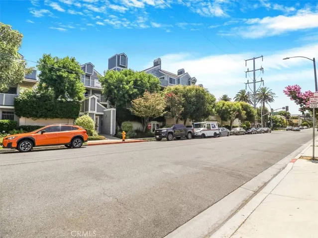 a view of street with parked cars