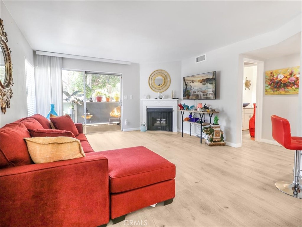 628 Daisy Avenue, Unit 222 Long Beach, CA 90802 - Photo 6 of 20 a living room with furniture and a fireplace