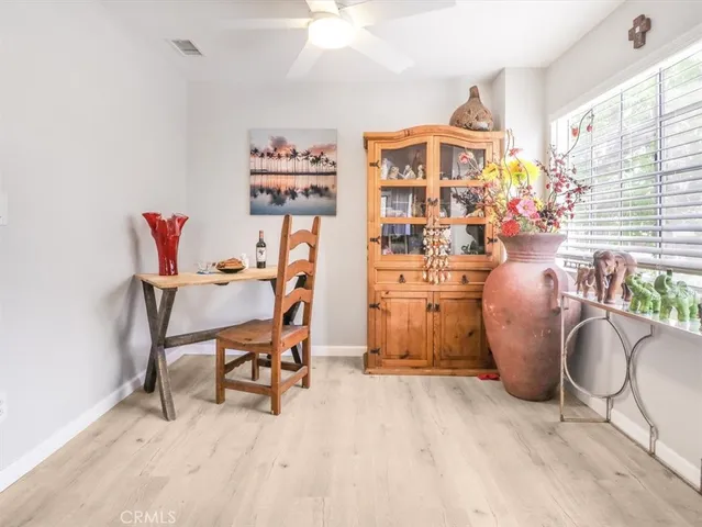 a work room with furniture and a chandelier