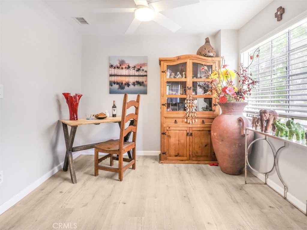 628 Daisy Avenue, Unit 222 Long Beach, CA 90802 - Photo 9 of 20 a work room with furniture and a chandelier