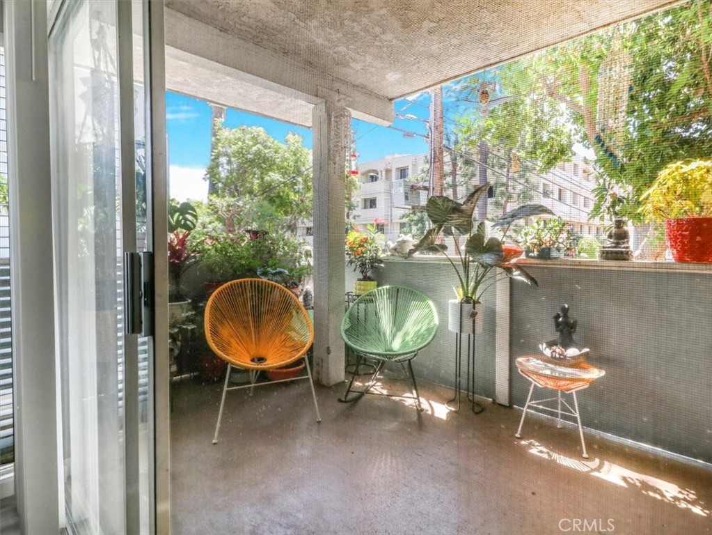 628 Daisy Avenue, Unit 222 Long Beach, CA 90802 - Photo 10 of 20 a room with a fireplace and a mirror