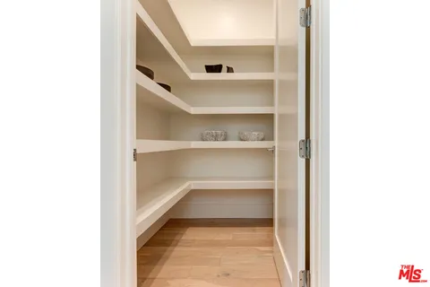 a view of a hallway with shelf