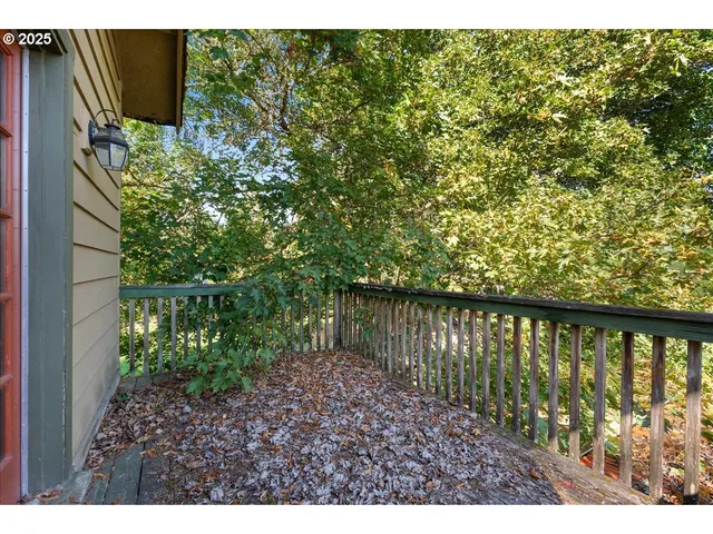 a view of balcony with wooden floor