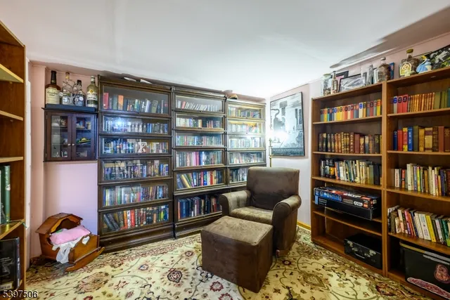 a livingroom with a book shelf and a book shelf