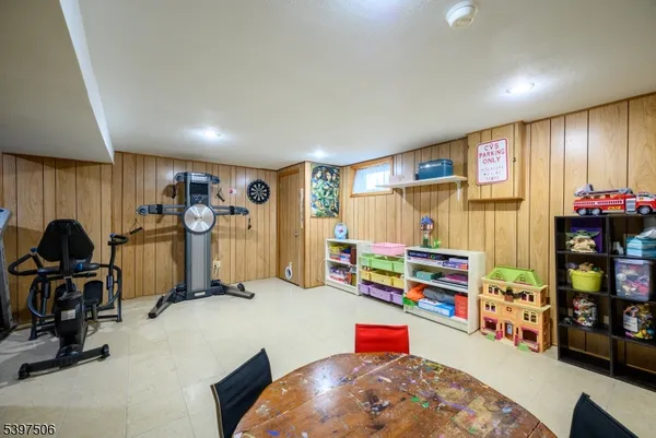 a room with gym equipment and a window