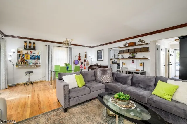 a living room with furniture and a rug