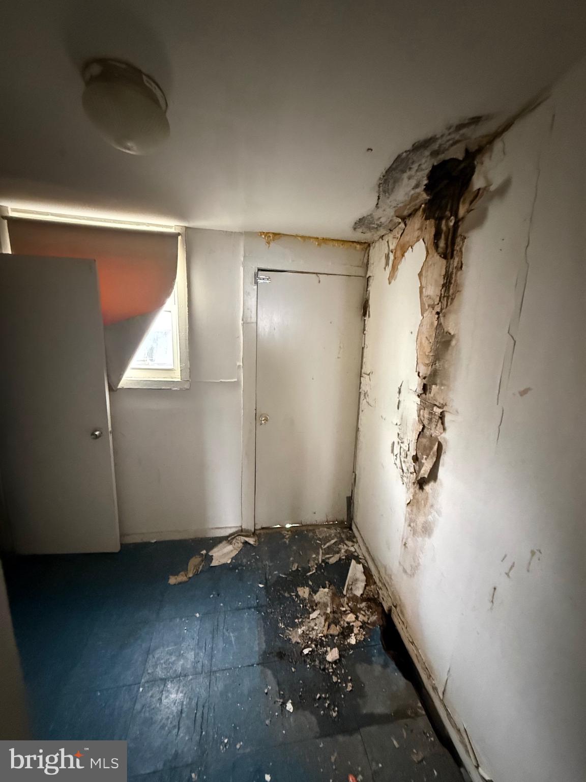 1903 Point Breeze Avenue Philadelphia, PA 19145 - Photo 8 of 9 an empty room with wooden floor