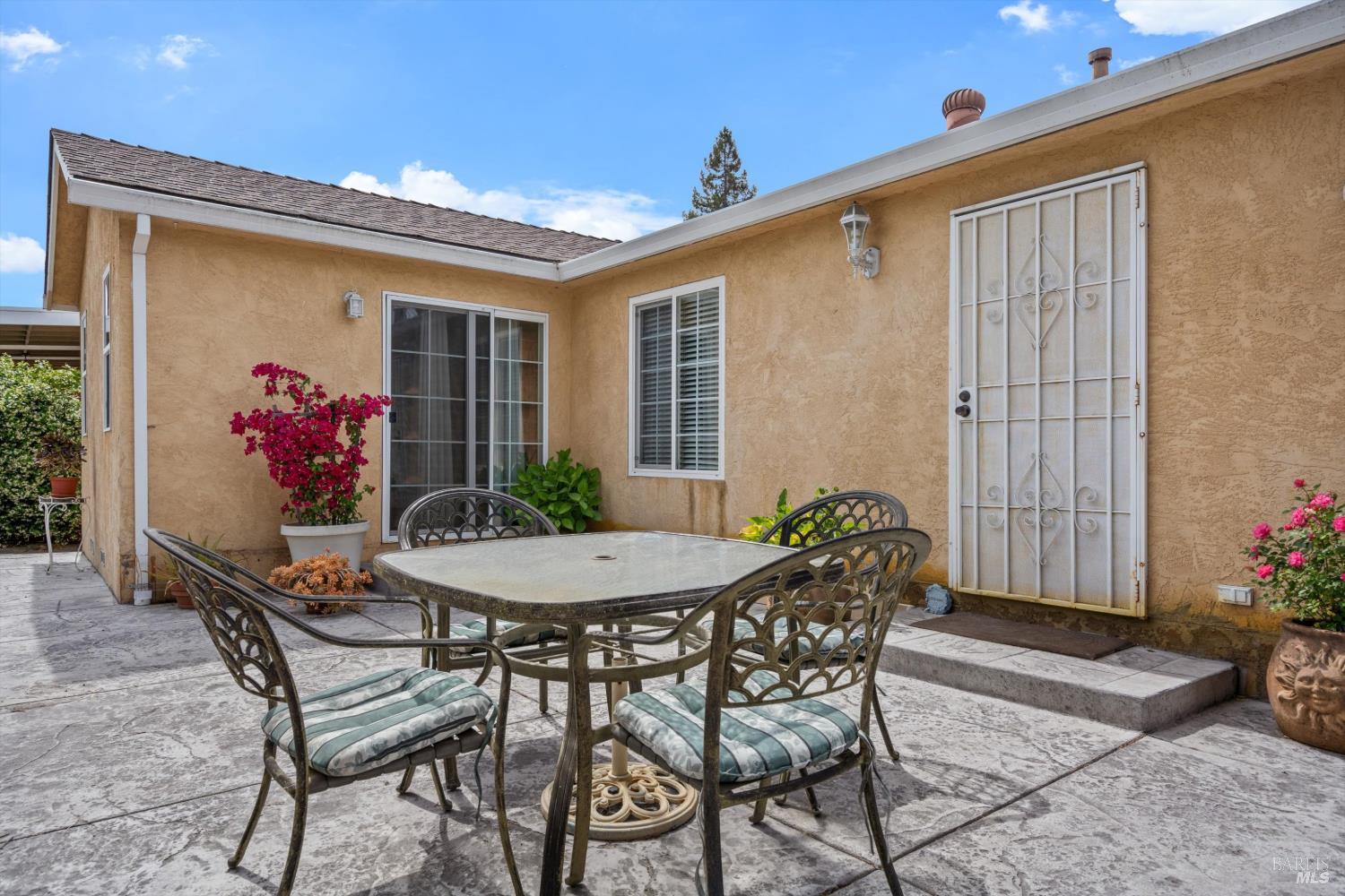 971 Eleanor Avenue Rohnert Park, CA 94928 - Photo 4 of 25 a view of a house with patio and a yard