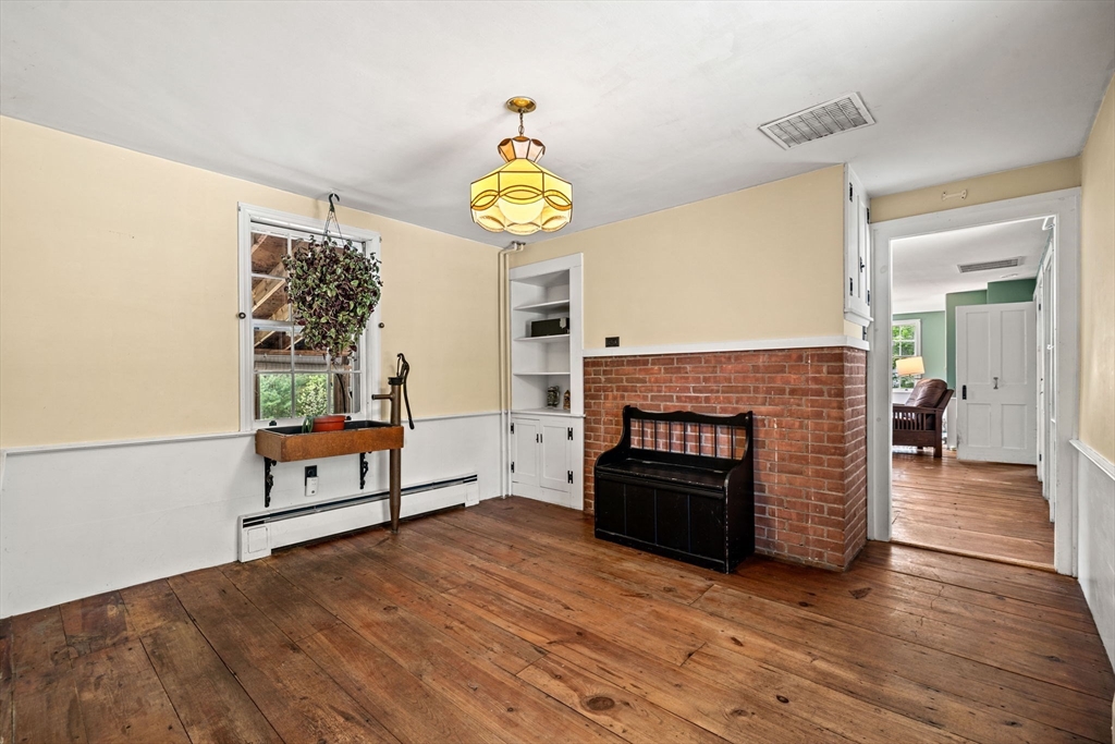 600 Main Street Ashby, MA 01431 - Photo 9 of 40 a living room with furniture and a fireplace