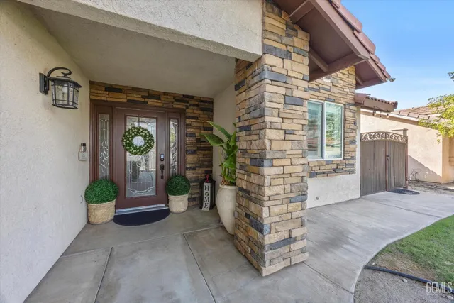 a view of a kitchen with refrigerator and wooden floor
