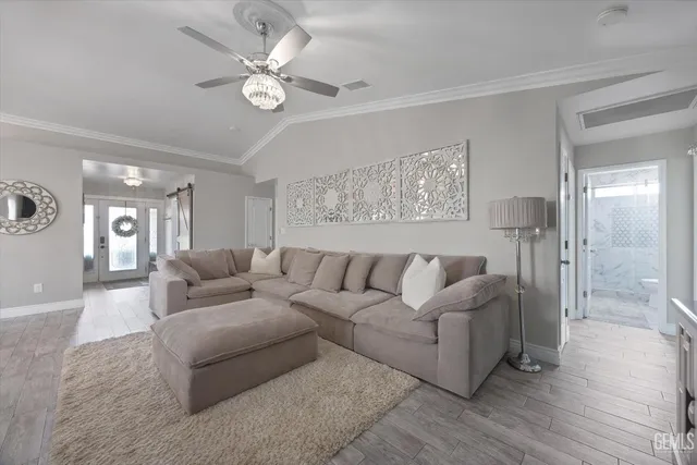 a kitchen with a refrigerator a sink and cabinets