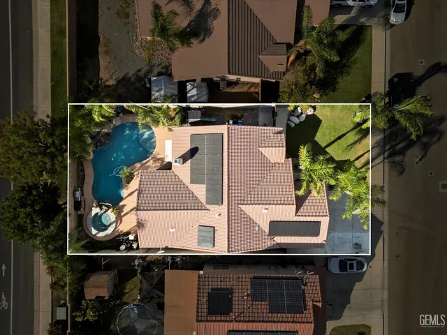 an aerial view of a house with outdoor space