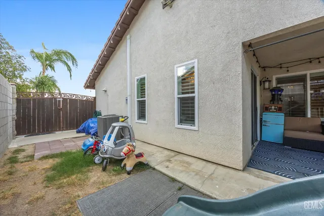 a view of a patio with couches and a fire pit