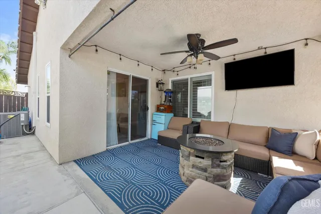 a view of a terrace with chairs and potted plants
