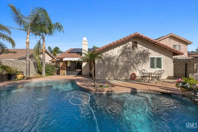an aerial view of houses with trees