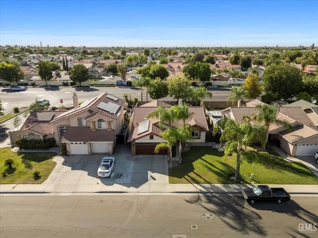 an aerial view of a house with a garden