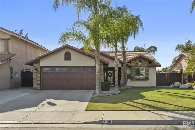 a view of swimming pool with palm trees