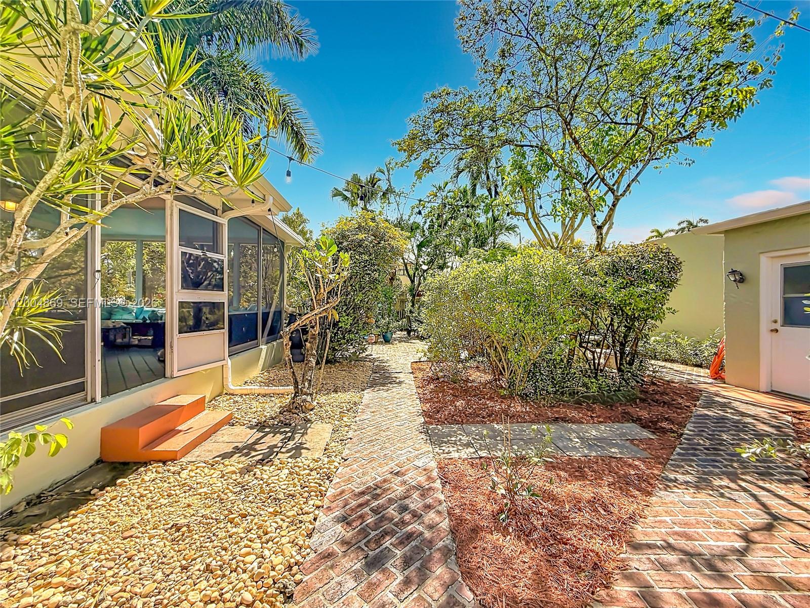 1029 Harrison Street Hollywood, FL 33019 - Photo 34 of 74 Screened Porch of Main House and Guest House to the right
