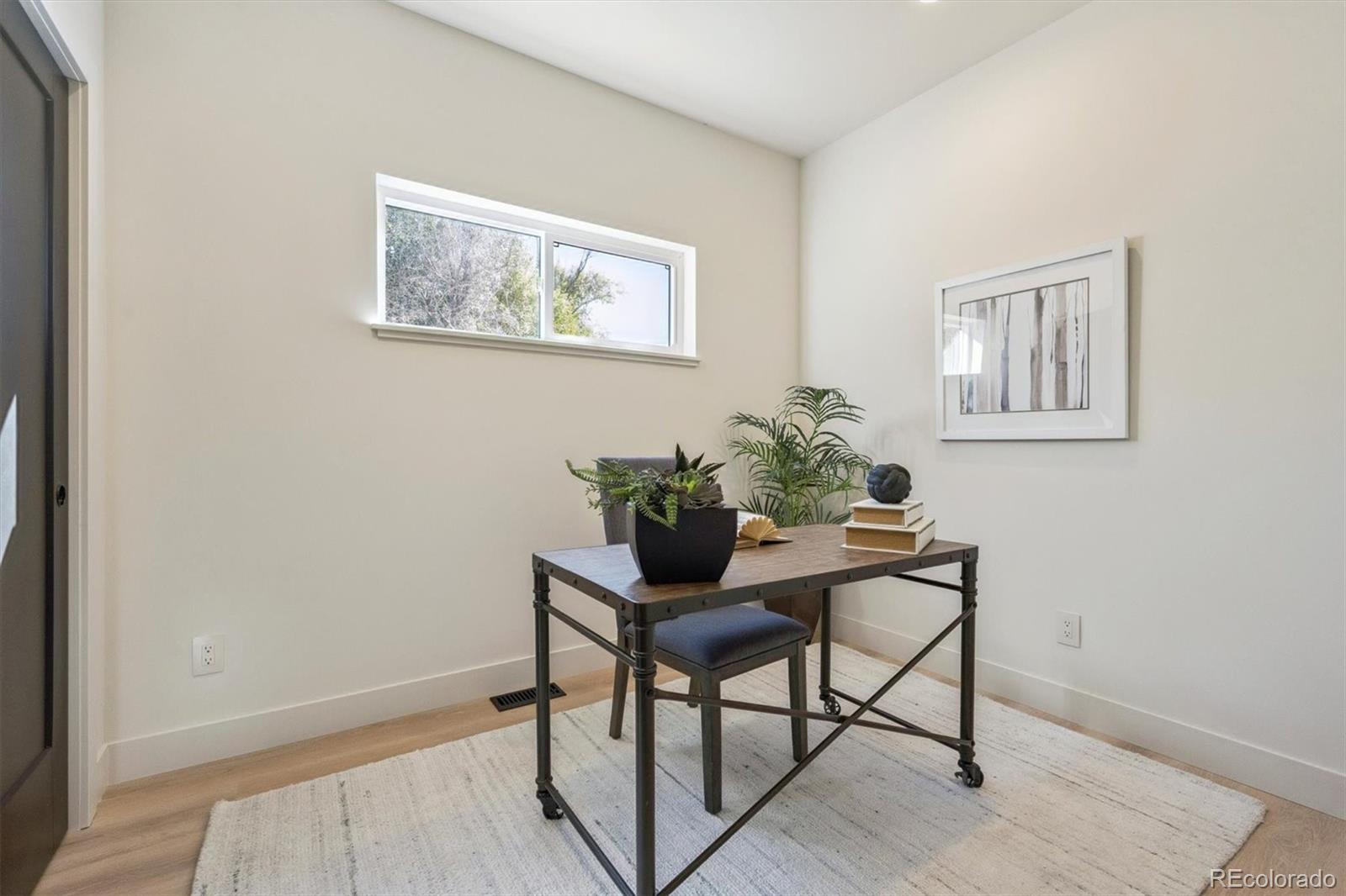 16170 Mt Vernon Road Golden, CO 80401 - Photo 14 of 44 a view of a workspace room with furniture and wooden floor