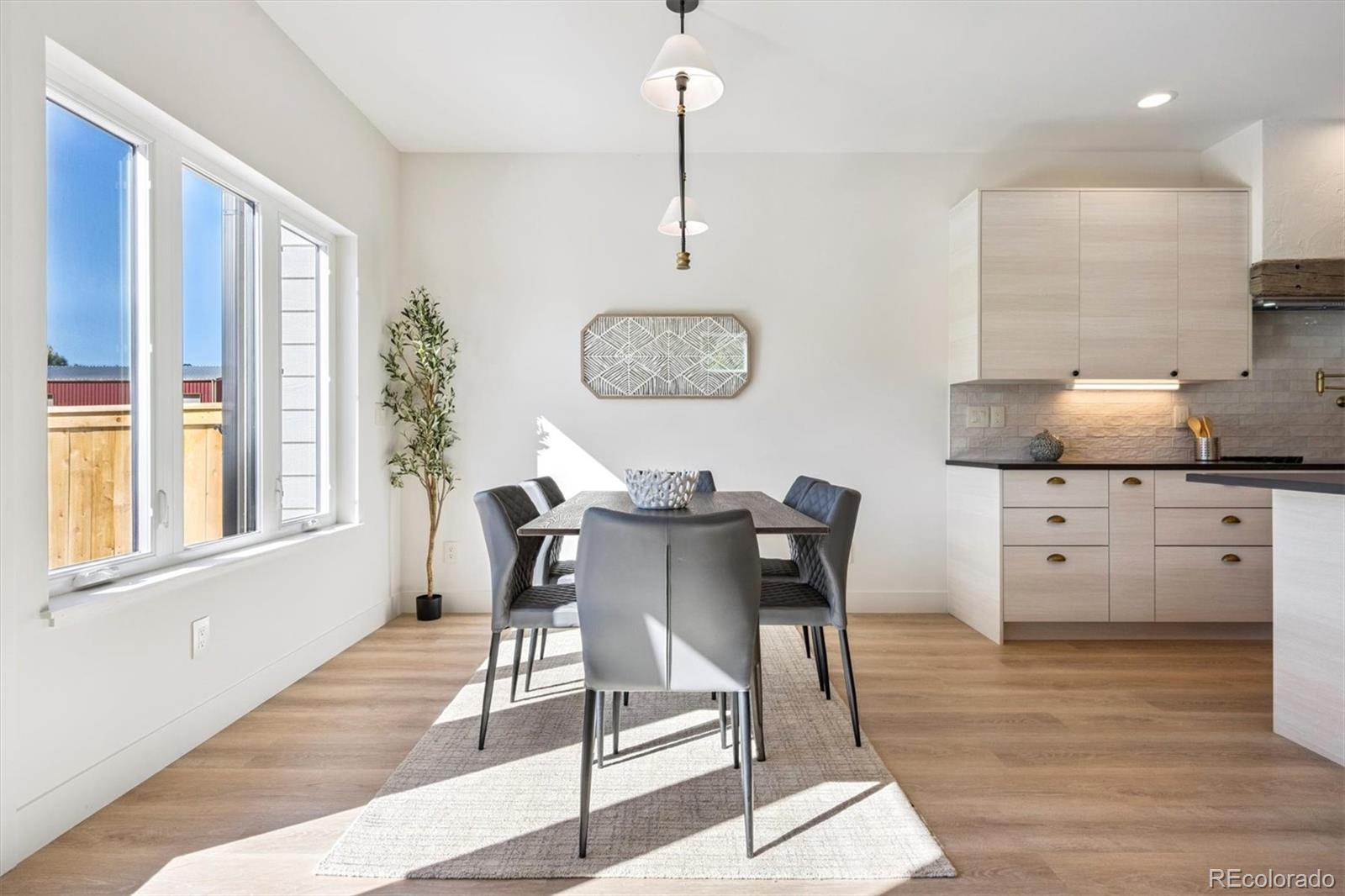 16170 Mt Vernon Road Golden, CO 80401 - Photo 7 of 44 a view of a dining room with furniture window and wooden floor
