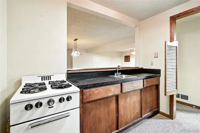 an empty room with an empty space and a ceiling fan