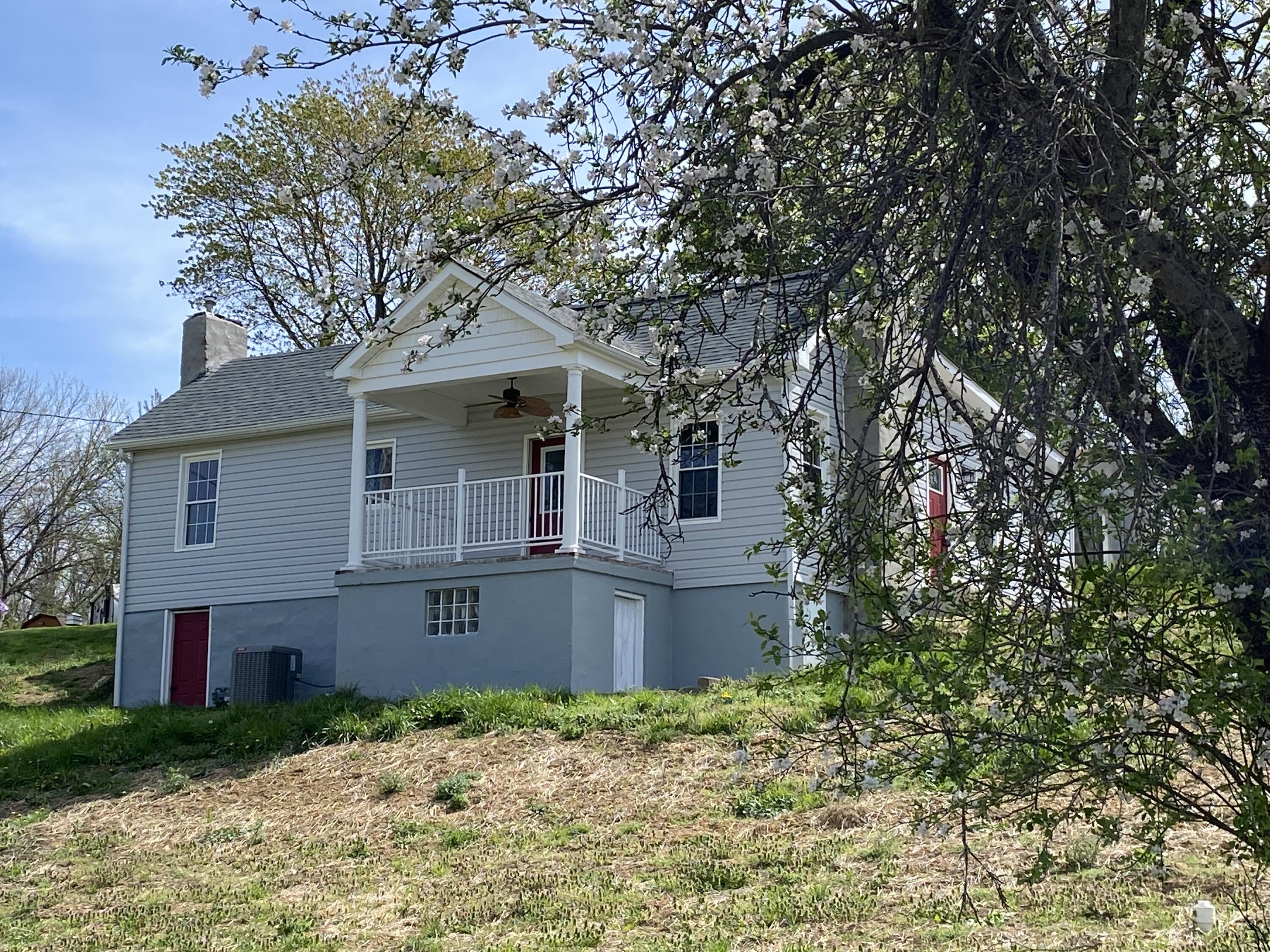 2812 Webster Road Blue Ridge, VA 24064 - Photo 2 of 38 a front view of a house with garden