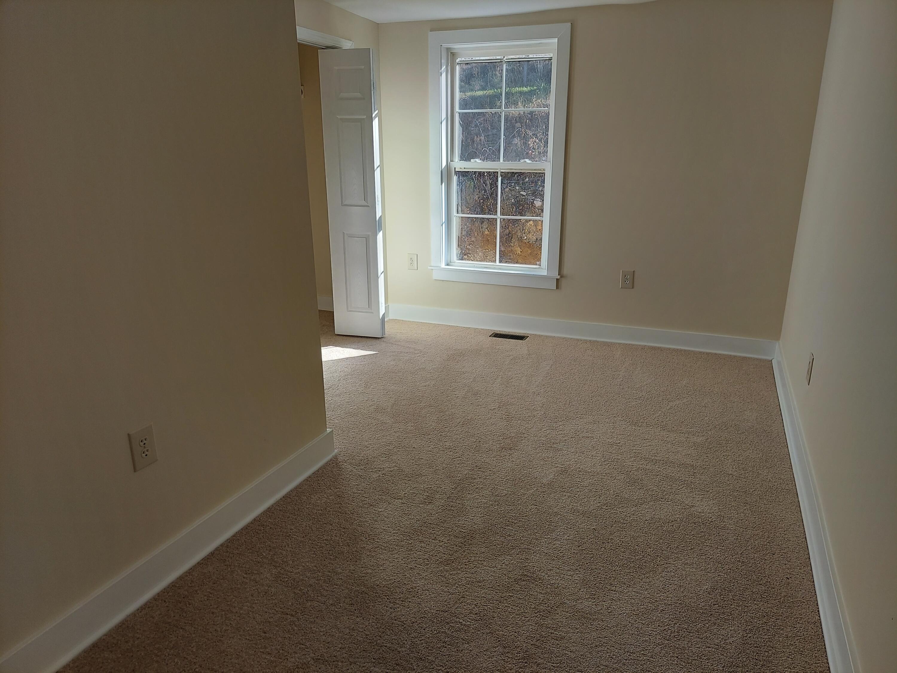 2812 Webster Road Blue Ridge, VA 24064 - Photo 23 of 38 an empty room with windows