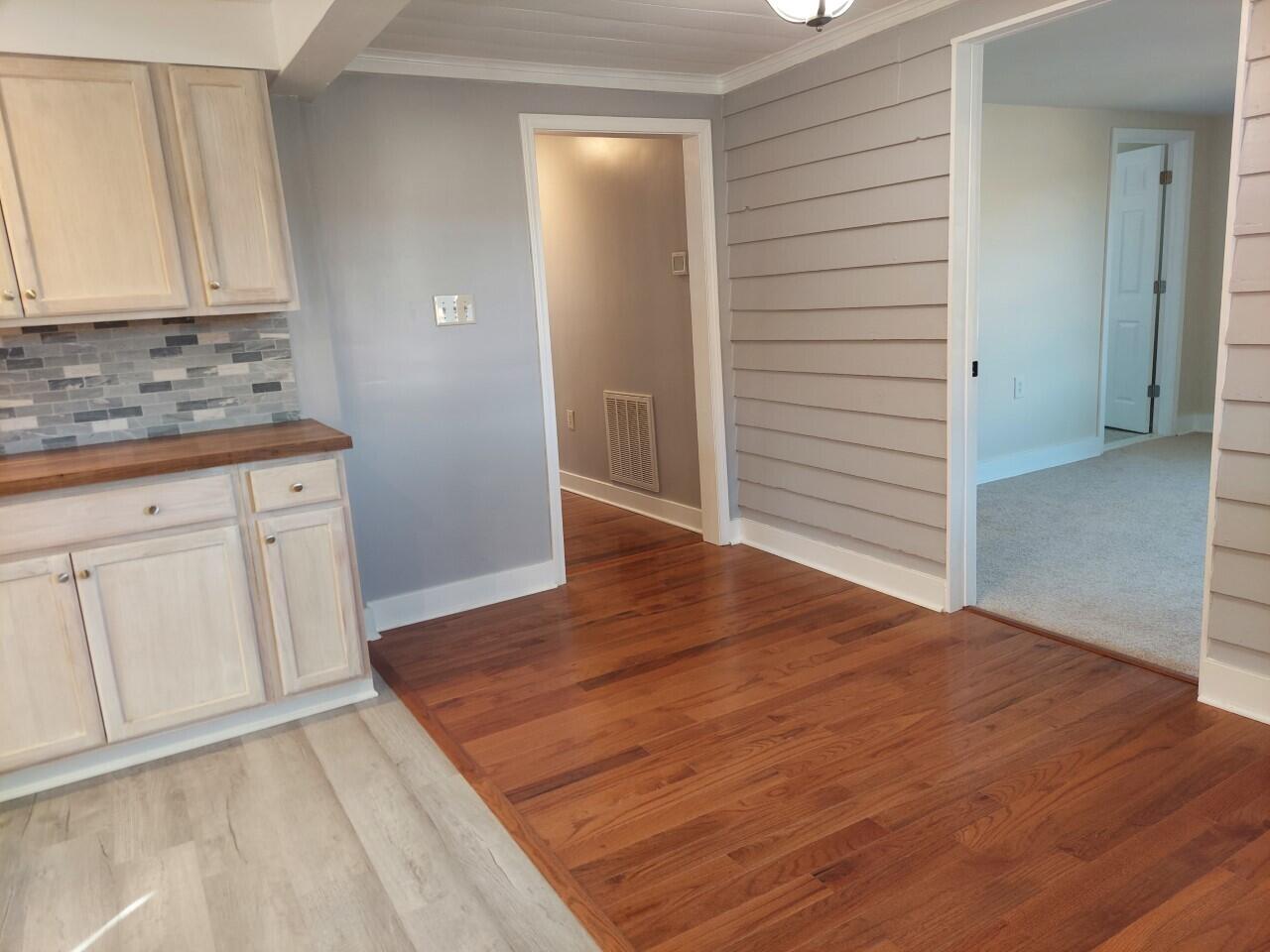2812 Webster Road Blue Ridge, VA 24064 - Photo 8 of 38 an empty room with wooden floor